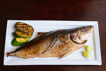 grilled tuna on a white plate served.
