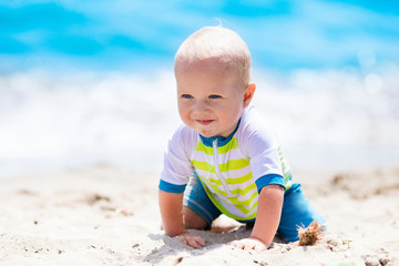 Baby boy on tropical beach