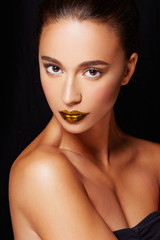 Beautiful model with olive skin, perfect skin texture and gold lip colors. 