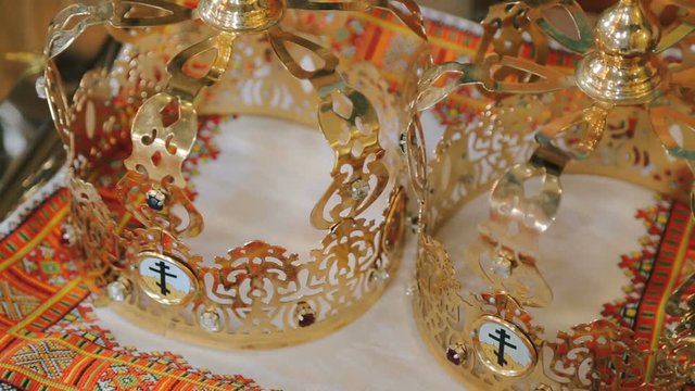 Close up of two wedding crowns prepared for ceremony of marriage in a church