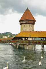 Naklejka premium Kapellbrucke - Chapel Bridge over Reussin in Lucerne. Switzerland