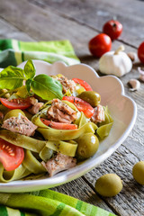 Tagliatelle pasta with tuna fish, tomato and olives