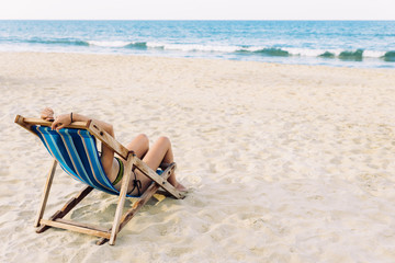 Fototapeta na wymiar Woman Relaxing On The Beach.