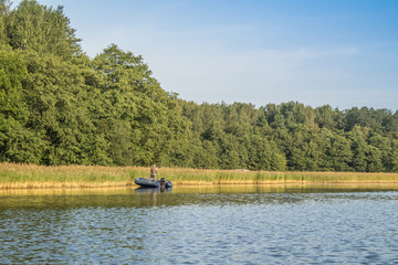 angler on the boat catch the fish