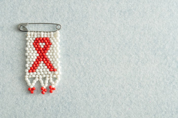 An aids ribbon as a bead work pin isolated