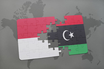 puzzle with the national flag of indonesia and libya on a world map background.