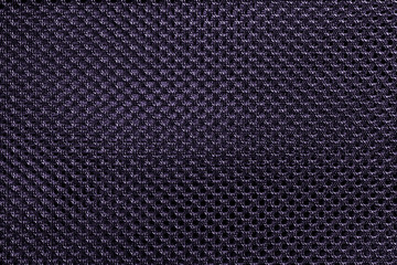 Purple fishnet cloth material as a texture background. Nylon texture pattern or nylon background for design with copy space for text or image.