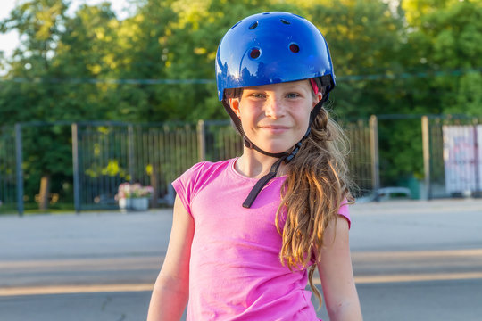 young girl skateboarding on natural background