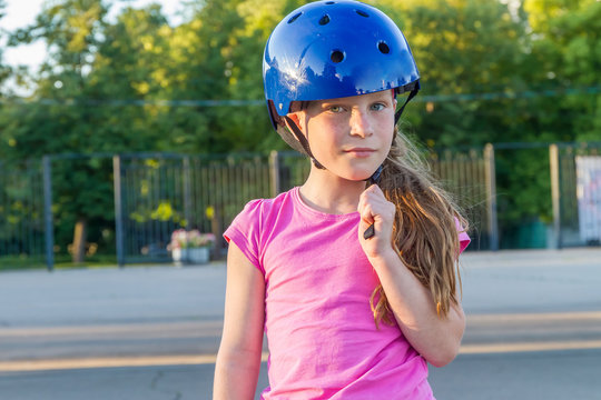 young girl skateboarding on natural background