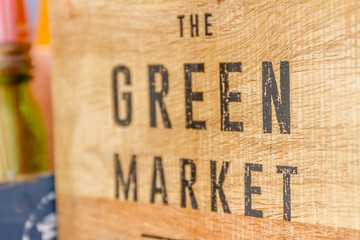 green market sign on wooden background, farmer market