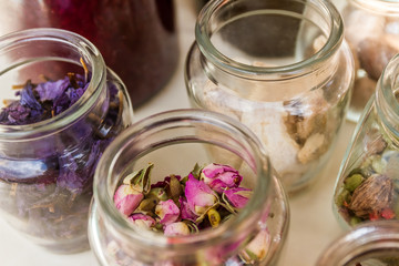 jars of loose dried tea leaves and flowers