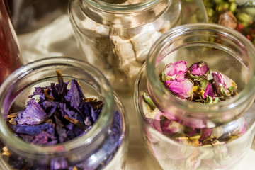 Obraz na płótnie Canvas jars of loose dried tea leaves and flowers