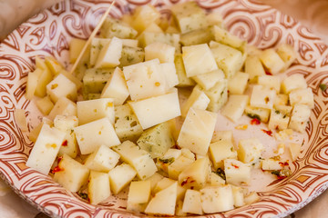 Various types of cheese for sale on food market