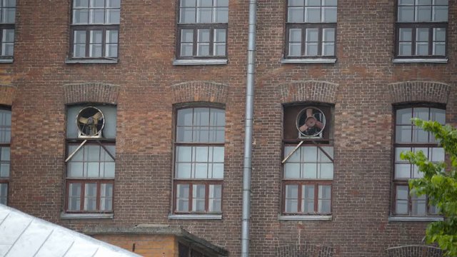 Two old exhaust fans on the windows of the Kreenholm textile factory in Narva