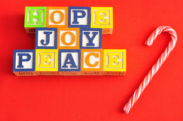 Xmas, Hope and Joy spelled with Alphabet blocks 