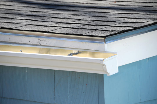 close up on gutter and new installed roof