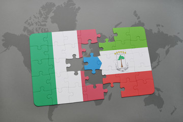 puzzle with the national flag of italy and equatorial guinea on a world map background.