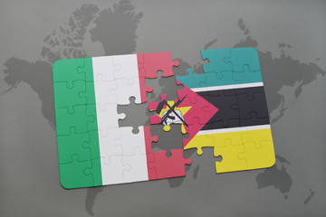puzzle with the national flag of italy and mozambique on a world map background.