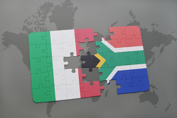 puzzle with the national flag of italy and south africa on a world map background.