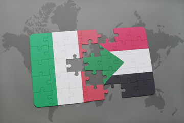 puzzle with the national flag of italy and sudan on a world map background.