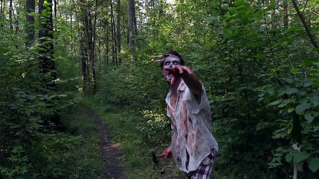 horrible zombie runs into the forest and looking for the victim