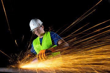 worker with angle grinder