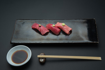 three styles fatty tuna sushi, akami, chuoro, otoro, with golden