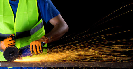 worker with angle grinder - obrazy, fototapety, plakaty