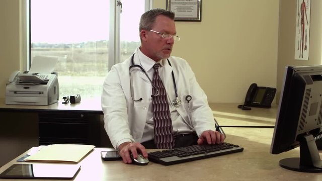 Doctor working on computer