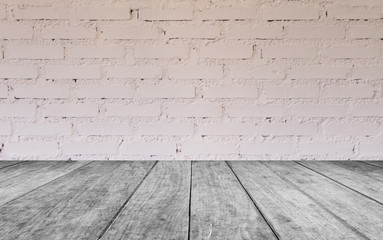Black and white wooden table top with brick wall