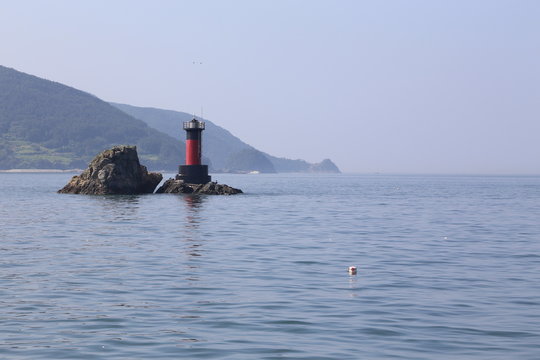 A red lighthouse, Tongyeong, Korea, Republic of.