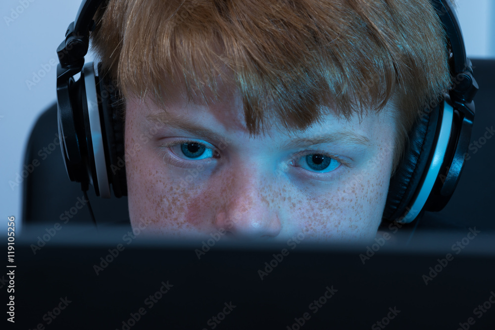 Poster boy working on computer
