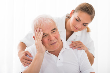 Fototapeta premium Doctor Consoling Male Patient