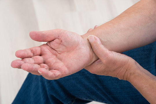 Person Holding Painful Wrist