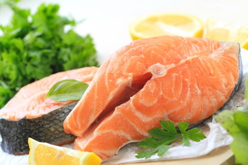 Raw fish with vegetables and lemon prepared for cooking