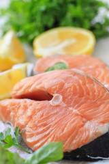 Raw fish with vegetables and lemon prepared for cooking
