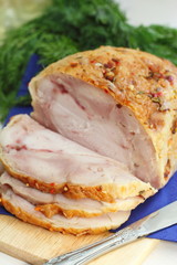 Sliced baked meat with spices and dill
