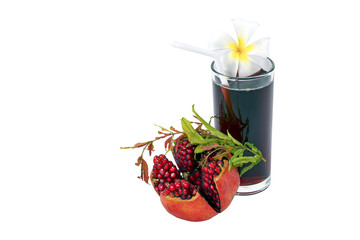 Pomegranate and juice on white background. With copy space.