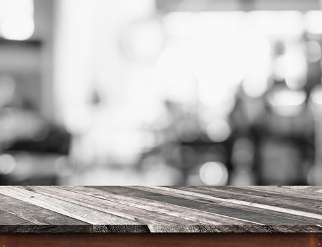 Empty grunge diagonal wood table top with black and white people