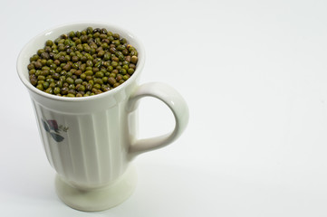 mung bean in cup, ceramic cup white color on white table