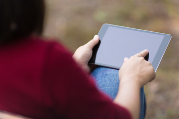 Woman Use Tablet at Park