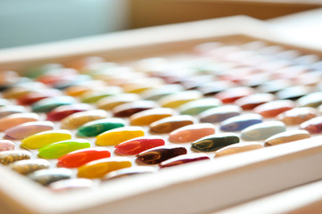 colorful artificial nails on shelves in beauty shop