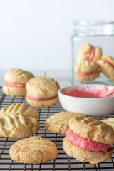 Close Up of Raspberry Filled Melting Moments on a Baking Rack Vertical Selective Focus