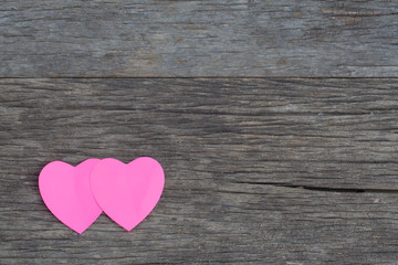 Fototapeta na wymiar Valentines concept, Pink paper hearts on wooden