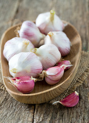 fresh garlic on wooden surface