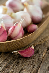 fresh garlic on wooden surface