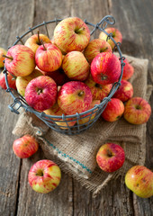 apples on wooden surface