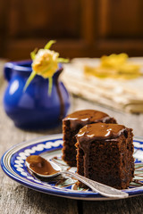 Chocolate brownie with zucchini on a rough wooden background. Proper nutrition. Healthy eating . Selective focus 