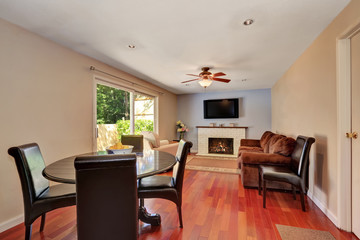 Dining and living room interior. Exit to the backyard.