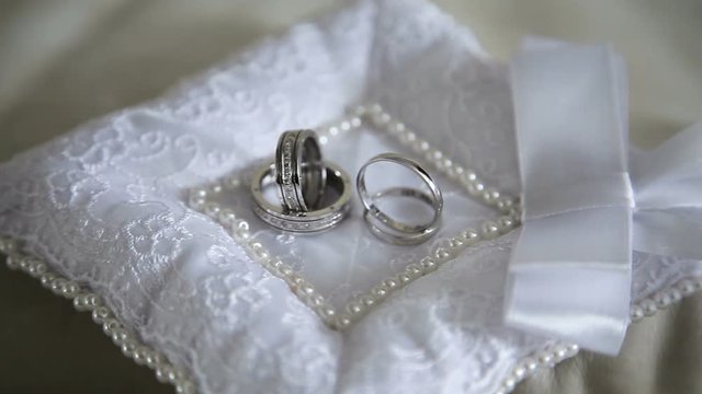 Two wedding ring on a beautiful cushion.Wedding concept.